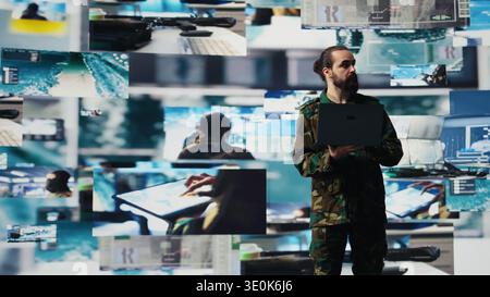 Officer monitoring real time combat data using advanced military systems, cyber tactics and digital surveillance to ensure battlefield control and strategic defense. War planning. Camera B. Stock Photo