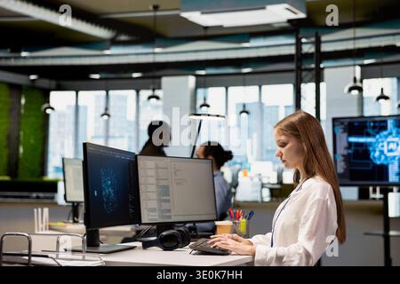 Junior software engineer consulting AI LLM chatbot for tips on how to enhance system performance. Intern relying on AI assistant to translate manual tasks into automated code Stock Photo