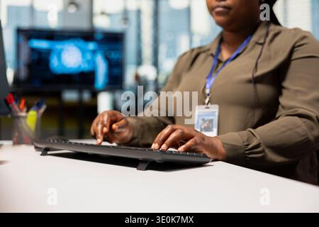 Close up of technician at work training deep learning models for anomaly detection automation. Tech startup worker using artificial intelligence to monitor hardware issues Stock Photo
