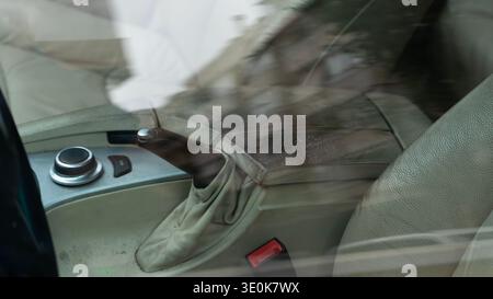 Car interior with manual parking brake lever and center console Stock Photo