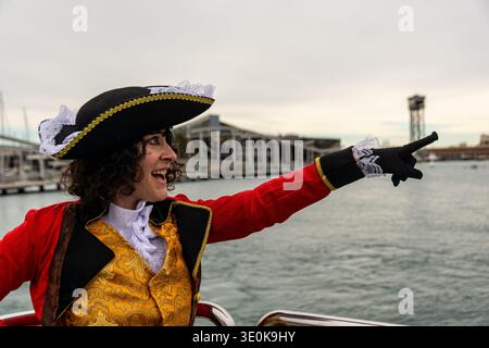Person in pirate costume pointing direction at harbor Stock Photo