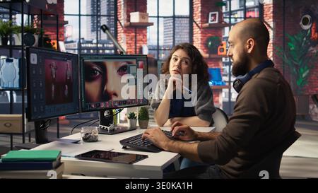 Photographers team collaborating on AI generated material using text to image tools. Editing software provides automation and advanced deep learning solutions for photo retouching. Camera A. Stock Photo
