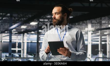Technicians on data center platform using devices to monitor neural network LLM visualization. Industrial server hub engineering team overseeing rigs powering machine learning processes Stock Photo