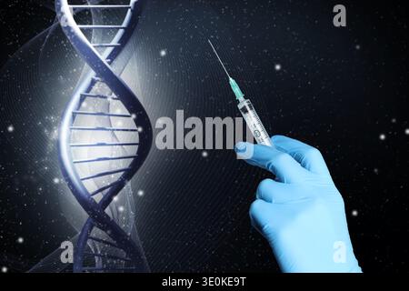 Scientist holding syringe against DNA spiral, closeup. Biochemistry and researches in genetics Stock Photo