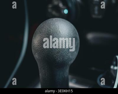 Black gear shift knob close-up in car interior dashboard automotive still life Stock Photo