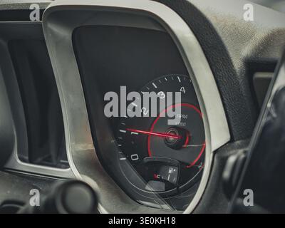 Car RPM tachometer gauge close-up on dashboard automotive interior still life Stock Photo