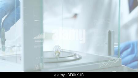 Adjusting tech in lab-coat, gloves using tool on bulb on balance in glass enclosure, HUD overlays Stock Photo