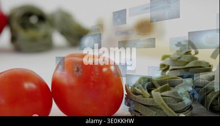 Displaying two red tomatoes with green pasta nests on white tabletop, showing holographic UI panels Stock Photo