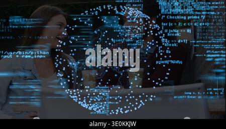 Leaning couple viewing laptop at cafe with two takeaway cups, woman in denim jacket, globe overlay Stock Photo