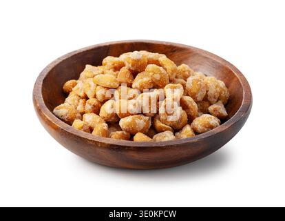 Honey roasted peanuts in a wooden bowl isolated on white background Stock Photo