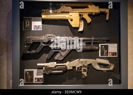 Lyon, France - 7 Jan 24: Science fiction prop weapons from the Alien franchise exhibited at Musée Cinéma et Miniature in Lyon, France. Stock Photo