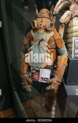 Lyon, France - 7 Jan 24: Detailed alien character puppet and costume piece exhibited behind glass at the Musee Cinema et Miniature in Lyon, France. Stock Photo