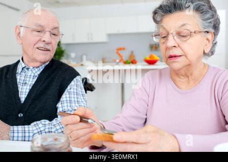 happy senior couple having breakfast Stock Photo