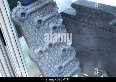 Products made from foamed polymers expanded polypropylene EPP and expanded polystyrene EPS. Model of dense and lightweight material, universal foam. New modern technologies. Industrial manufacturing Stock Photo