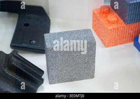 Products made from foamed polymers expanded polypropylene EPP and expanded polystyrene EPS. Model of dense and lightweight material, universal foam. New modern technologies. Industrial manufacturing Stock Photo