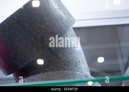 Products made from foamed polymers expanded polypropylene EPP and expanded polystyrene EPS. Model of dense and lightweight material, universal foam. New modern technologies. Industrial manufacturing Stock Photo