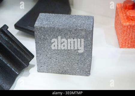 Products made from foamed polymers expanded polypropylene EPP and expanded polystyrene EPS. Model of dense and lightweight material, universal foam. New modern technologies. Industrial manufacturing Stock Photo