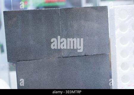 Products made from foamed polymers expanded polypropylene EPP and expanded polystyrene EPS. Model of dense and lightweight material, universal foam. New modern technologies. Industrial manufacturing Stock Photo