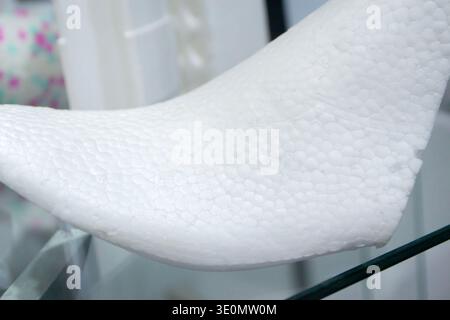 Foam plastic shoe mold. Products made from foamed polymers expanded polypropylene EPP and expanded polystyrene EPS. Model of dense and lightweight material, universal foam. New modern technologies Stock Photo