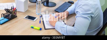 Banner of unrecognizable businessman analyzing data and working in a coworking office Stock Photo