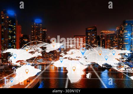 A city skyline shows connections on a world map with bright lights at night Stock Photo