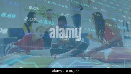 Working group of six casually dressed adults in lounge with laptops, pizza and financial overlay Stock Photo