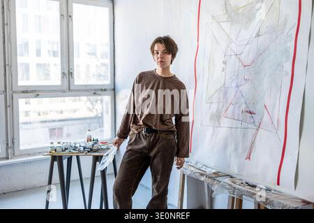 Portrait of female artist in her studio Stock Photo