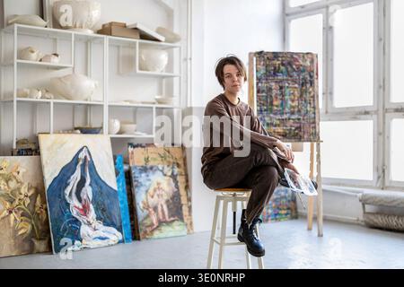Portrait of female artist in her studio Stock Photo