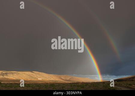 double rainbow over the semi-desert , Canary Islands, Lanzarote, Teguise Stock Photo