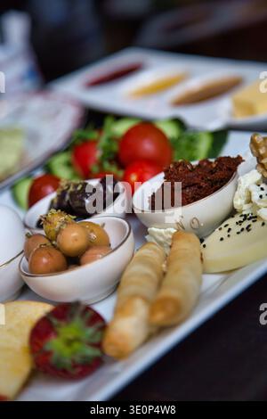 A Vibrant Spread Of Turkish Mezze With Assorted Vegetables And Dips. Stock Photo