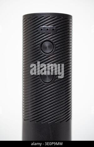 Modern black cylindrical gadget with textured surface and two sensor buttons. Perfect for home or office use. Shot on white background to highlight de Stock Photo