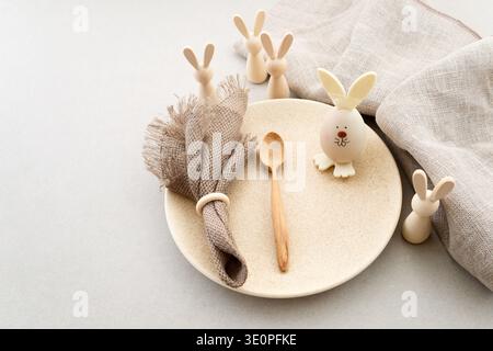 Zero waste Easter. Easter table setting with rustic bunny decorations Stock Photo