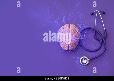 Brain model having glowing neural activity lines, next to a stethoscope Stock Photo