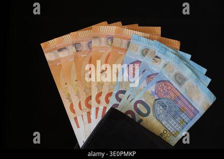euro banknotes sticking out of wallet, the concept of the currency of the money. Stock Photo