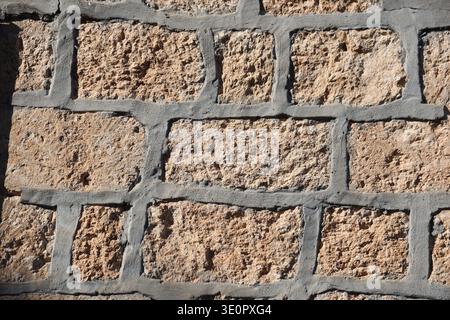 old stone wall with rough surface Stock Photo