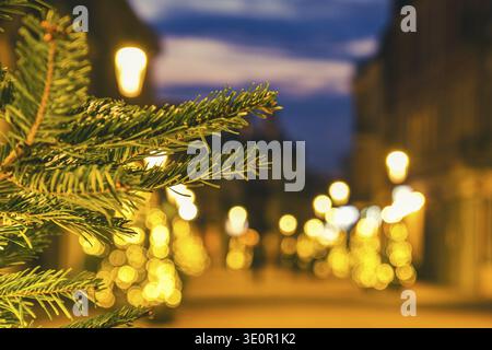 Blurred zoom out background city street with Christmas illuminations, blurred holiday background. Christmas lights and Christmas decorations on the st Stock Photo