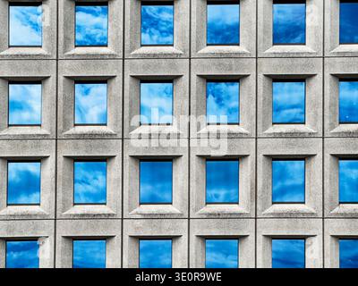Clouds are reflected in the window glass of a modern office building in Copenhagen, Denmark. Stock Photo