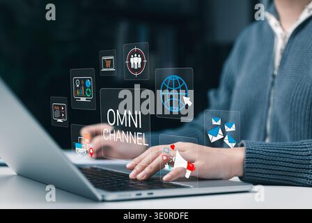 Omnichannel marketing concept. Digital customer engagement and communication channels. Woman using laptop to manage online marketing, analytics, email Stock Photo
