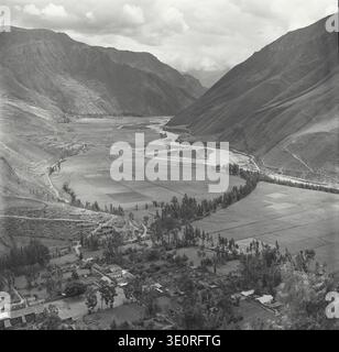 Aerial view of the Urubamba River winding through a deep, lush green ...