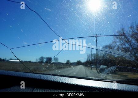 Cracked windshield on car glass in countryside Stock Photo