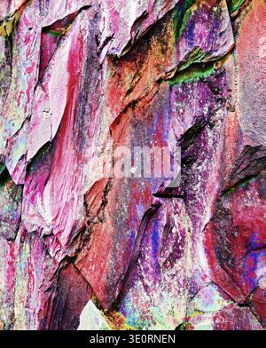 A close-up of colorful rock and mineral detail and rugged, weathered surfaces. Stock Photo