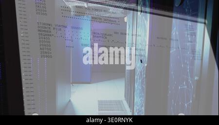 Displaying server room corridor with rack cabinets, raised floor, reflective glass showing SQL text Stock Photo