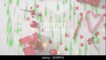 Displaying red gift box with silver ribbon sitting left on wooden table under green binary overlay Stock Photo