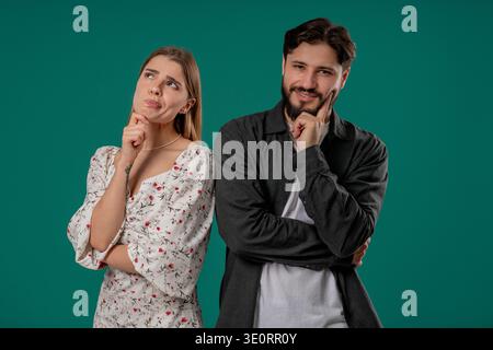 Young Pretty Woman Gazes Dreamily, Bearded Male Partner Looks Thoughtful,Focused Stock Photo