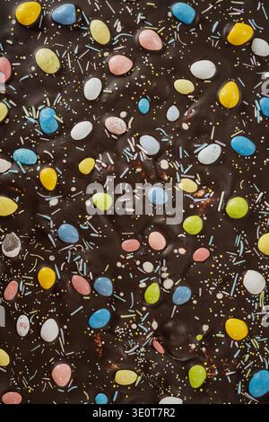 Dark Chocolate Bark with Pastel Mini Eggs and Colorful Sprinkles Stock Photo