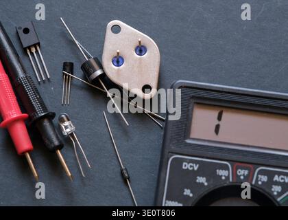 Electronic components on the table. Semiconductor diodes and transistors. Stock Photo