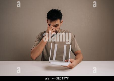 Front view of technician male holding wireless internet router, connecting to global communication networks, representing home connectivity and modern Stock Photo