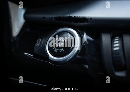 BMW X5 start stop engine button on glossy black center console Stock Photo