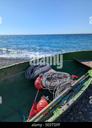 Close-up of Fishing Boat with Coiled Ropes and Buoys on Black Sea Beach in Kobuleti Georgia Stock Photo