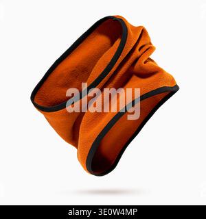 Soft orange fleece neck warmer with black edging floating on white background. Concept of warm winter thermal gear, cozy fabric texture, outdoor comfo Stock Photo